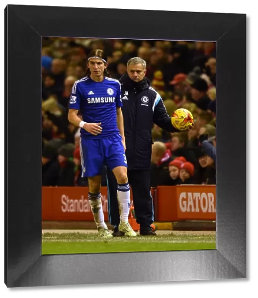 Jose Mourinho's Unwavering Focus: Chelsea Manager Holds the Ball Amidst the Intense Semi-Final Clash with Liverpool in Capital One Cup (Liverpool v Chelsea, 20th January 2015)