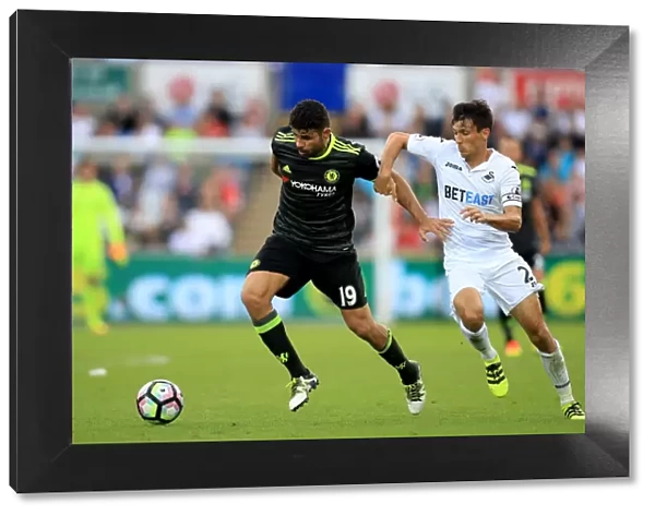 Intense Battle for Ball Possession: Diego Costa vs Jack Cork, Swansea City vs Chelsea, Premier League, Liberty Stadium