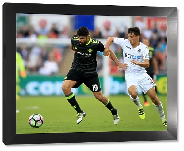 Intense Battle for Ball Possession: Diego Costa vs Jack Cork, Swansea City vs Chelsea, Premier League, Liberty Stadium