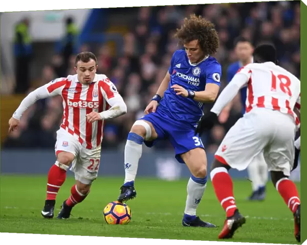 David Luiz Stands Firm: Chelsea vs Stoke City Clash - Luiz Fends Off Diouf and Shaqiri Pressure