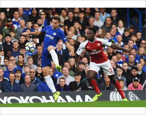 Azpilicueta vs. Welbeck: Battle for Possession in Chelsea vs. Arsenal Premier League Clash