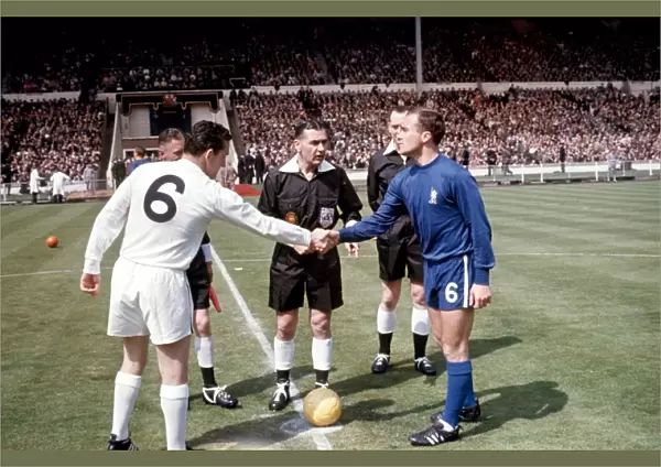 The 1960s FA Cup Final: A Historic Moment as Captains Dave Mackay of Tottenham Hotspur and Ron Harris of Chelsea Share a Handshake Before the Match