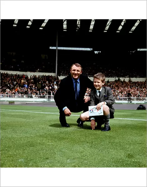 Tommy Docherty and a Young Fan: A Historic Moment on the Wembley Pitch before the FA Cup Final between Chelsea and Tottenham Hotspur (1960s)