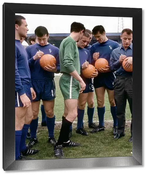 Footballers of Chelsea's Division One Team Signing Footballs Before FA Cup Final: Ron Harris, John Boyle, Peter Bonetti, Alan Harris, and Tommy Docherty