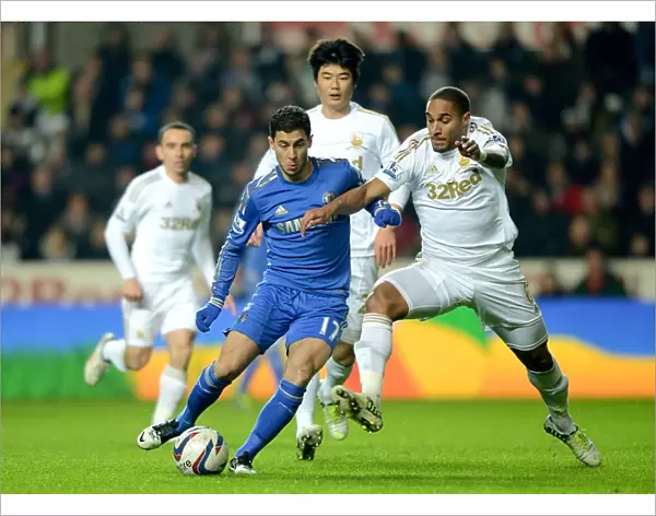 Battle for Ball Supremacy: Eden Hazard vs. Ashley Williams in the Intense Chelsea-Swansea League Cup Semi-Final Clash