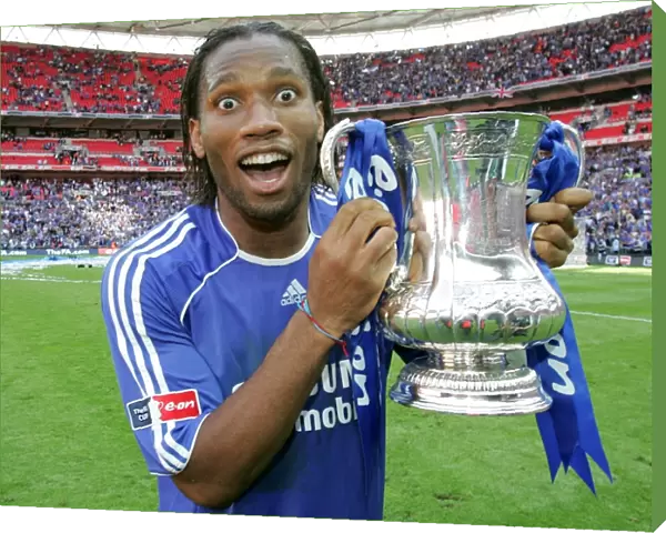 Chelsea's Glory: FA Cup Victory - Didier Drogba Celebrates with the Trophy (May 2007)