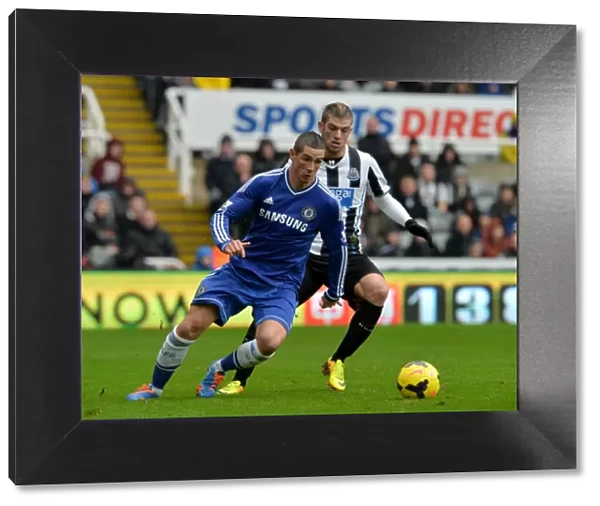 Intense Battle for Ball Possession: Fernando Torres vs. Davide Santon - Newcastle United vs. Chelsea (November 2013)
