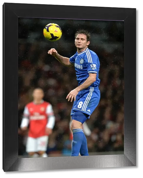 Frank Lampard Soaring High: Heading the Ball Against Arsenal in the Premier League Rivalry (December 23, 2013)