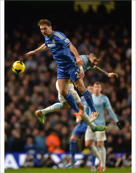 Clash in the Sky: Ivanovic vs. Kolarov - A Premier League Battle for Possession (Manchester City vs. Chelsea, 2014)