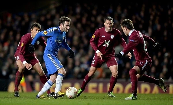 Chelsea's Juan Mata Battles Rubin Kazan Defense in UEFA Europa League Quarterfinal at Stamford Bridge (April 4, 2013)