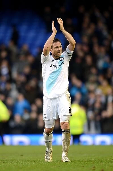 Frank Lampard's Triumphant Acknowledgment: Chelsea's Barclays Premier League Victory at Everton's Goodison Park (December 30, 2012)