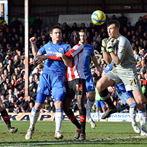 Frank Lampard's Shot Defied by Brentford Goalkeeper Moore in FA Cup Clash (January 2013)