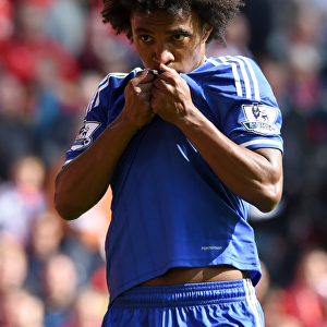 Willian's Brilliant Brace: Chelsea's Star Winger Celebrates Scoring the Second Goal Against Liverpool at Anfield (BPL 2014)