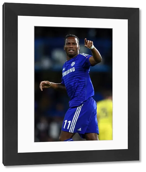Didier Drogba's Thrilling Double: Chelsea's Star Forward Celebrates Second Goal vs. NK Maribor in UEFA Champions League (October 21, 2014)