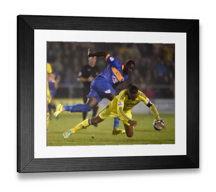 Framed Print : Didier Drogba vs. Jermaine Grandison: A Fierce Rivalry Unfolds - Chelsea vs. Shrewsbury Town, Capital One Cup Fourth Round Framed Print : Didier Drogba vs. Jermaine Grandison: A Fierce Rivalry Unfolds - Chelsea vs. Shrewsbury Town, Capital One Cup Fourth Round