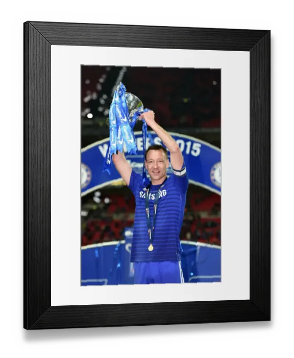 Framed Print : Chelsea's John Terry Lifts Carling Cup: Celebrating Victory over Tottenham Hotspur at Wembley Stadium (1st March 2015)
