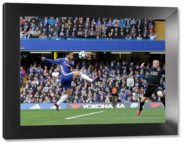 Hazard vs. Schmeichel: A Premier League Showdown - Eden Hazard Attempts to Score Past Kasper Schmeichel at Stamford Bridge