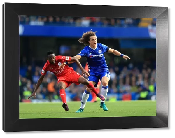 Intense Premier League Rivalry: David Luiz vs. Ahmed Musa - Battle for Ball Possession at Stamford Bridge