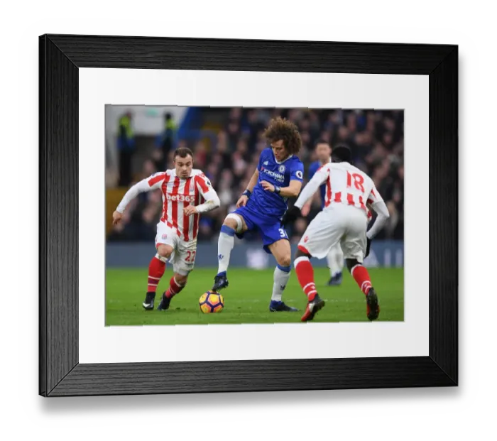 Framed Print : David Luiz Stands Firm: Chelsea vs Stoke City Clash - Luiz Fends Off Diouf and Shaqiri Pressure