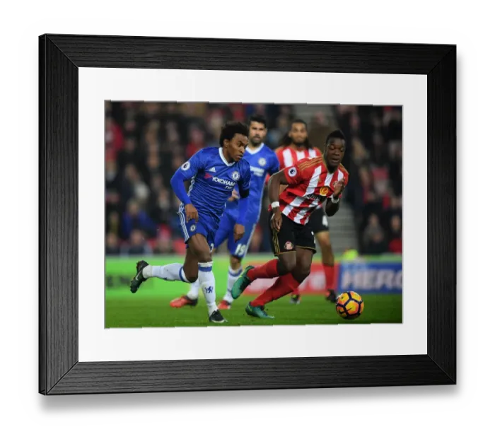 Framed Print : Willian vs. Kone: A Premier League Battle at Sunderland's Stadium of Light Framed Print : Willian vs. Kone: A Premier League Battle at Sunderland's Stadium of Light