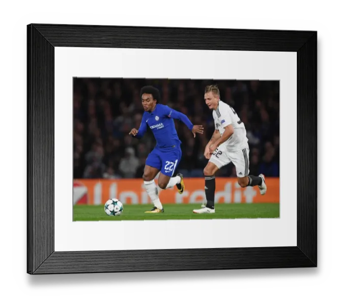 Framed Print : Willian vs Rzezniczak: A Champions League Clash at Stamford Bridge