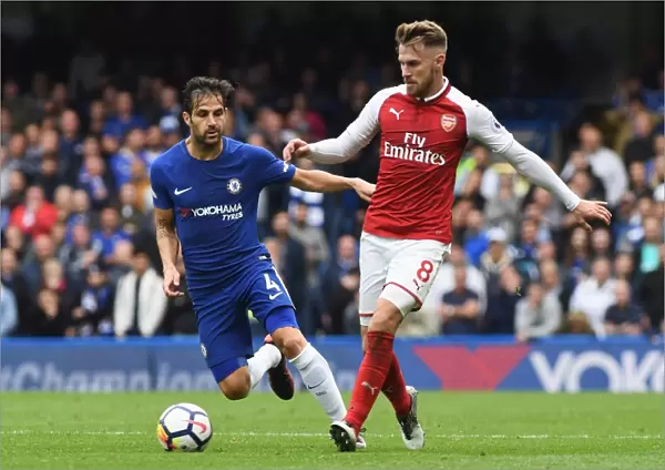 Intense Rivalry: Fabregas vs Ramsey Battle at Stamford Bridge, Premier League