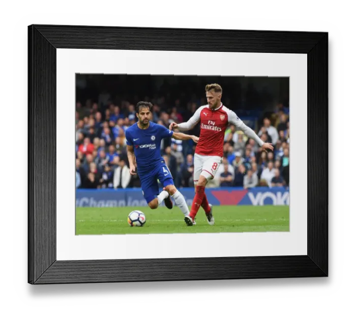 Framed Print : Intense Rivalry: Fabregas vs Ramsey Battle at Stamford Bridge, Premier League Framed Print : Intense Rivalry: Fabregas vs Ramsey Battle at Stamford Bridge, Premier League