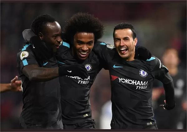 Chelsea Players Celebrate Pedro's Goal in Premier League Match Against Huddersfield Town