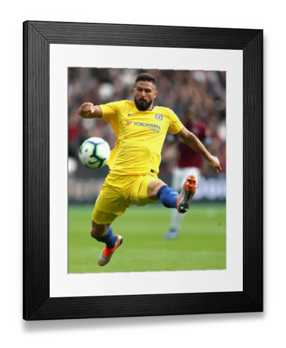Framed Print : Chelsea's Olivier Giroud Reaches for the Ball in Intense West Ham Clash Framed Print : Chelsea's Olivier Giroud Reaches for the Ball in Intense West Ham Clash