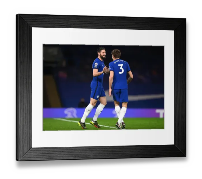 Framed Print : Chelsea's Olivier Giroud and Marcos Alonso Celebrate First Goal Against Newcastle United in Empty Stamford Bridge Framed Print : Chelsea's Olivier Giroud and Marcos Alonso Celebrate First Goal Against Newcastle United in Empty Stamford Bridge