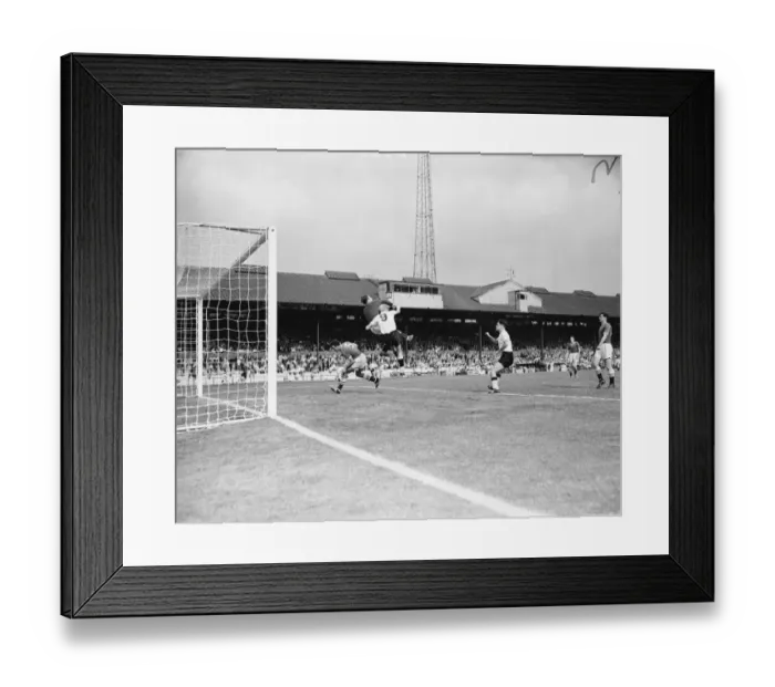 Framed Print : Chelsea vs. Burnley: Intense Moment as Mel Scott Ducks and Reg Matthews Clears the Ball from Ray Pointer Framed Print : Chelsea vs. Burnley: Intense Moment as Mel Scott Ducks and Reg Matthews Clears the Ball from Ray Pointer