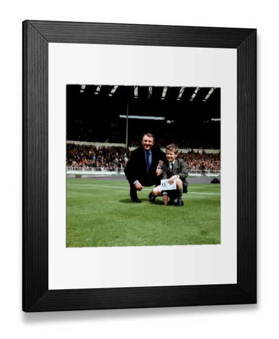 Framed Print : Tommy Docherty and a Young Fan: A Historic Moment on the Wembley Pitch before the FA Cup Final between Chelsea and Tottenham Hotspur (1960s)