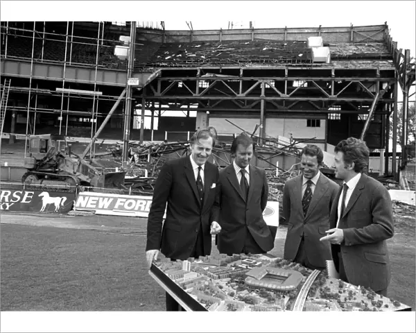Chelsea's New Developments: Roger Bannister, Brian Mears, Dave Sexton, and John Darbourne Examine Stamford Bridge Model Amid Demolition