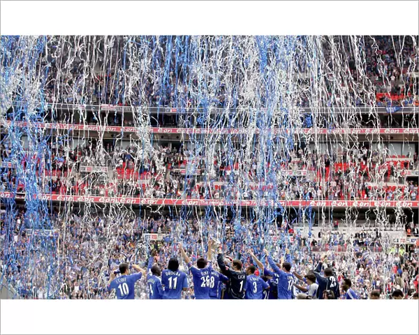 Chelsea Celebrates FA Cup Victory: Chelsea Players and the FA Cup Trophy at Wembley Stadium (vs Manchester United)