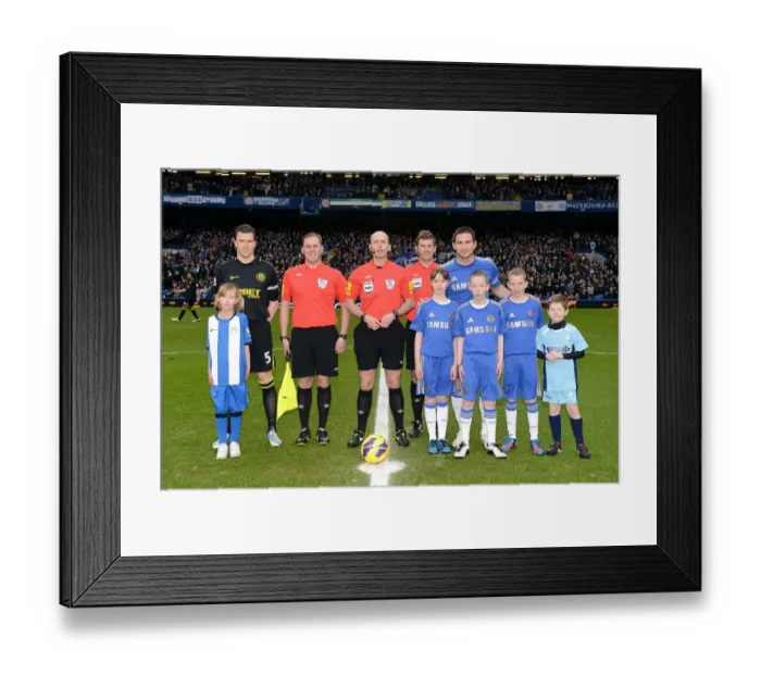 Framed Print : Frank Lampard and Gary Caldwell Lead Teams Out at Stamford Bridge: Premier League Clash between Chelsea and Wigan Athletic - Mike Dean Referees with Match Mascots Framed Print : Frank Lampard and Gary Caldwell Lead Teams Out at Stamford Bridge: Premier League Clash between Chelsea and Wigan Athletic - Mike Dean Referees with Match Mascots