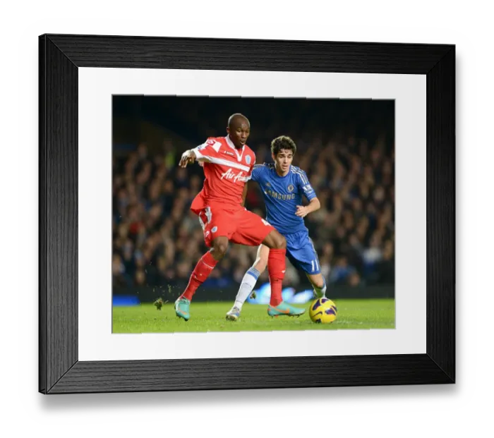 Framed Print : Battle for the Ball: Oscar vs. Mbia - Chelsea vs. QPR, Premier League (January 2, 2013)