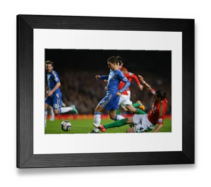 Framed Print : Eden Hazard Dodges Chico's Tackle in Intense League Cup Semi-Final Clash between Chelsea and Swansea (January 9, 2013)