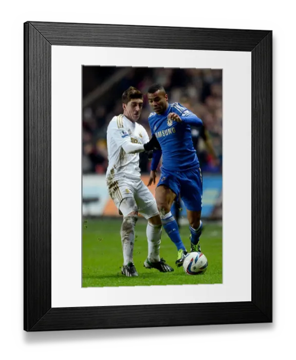 Framed Print : Intense Rivalry: Ashley Cole vs. Pablo Hernandez - Chelsea's Capital One Cup Semi-Final Showdown at Swansea's Liberty Stadium Framed Print : Intense Rivalry: Ashley Cole vs. Pablo Hernandez - Chelsea's Capital One Cup Semi-Final Showdown at Swansea's Liberty Stadium