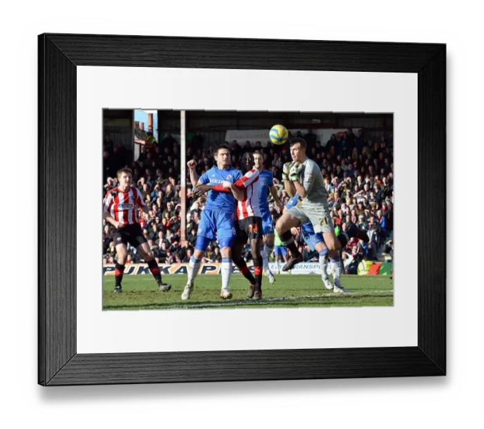 Framed Print : Frank Lampard's Shot Defied by Brentford Goalkeeper Moore in FA Cup Clash (January 2013) Framed Print : Frank Lampard's Shot Defied by Brentford Goalkeeper Moore in FA Cup Clash (January 2013)