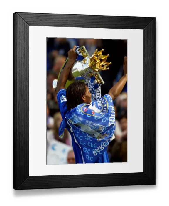 Framed Print : Didier Drogba's Triumph: Celebrating Chelsea's Premier League Victory with the FA Barclays Trophy at Stamford Bridge (2004-2005)