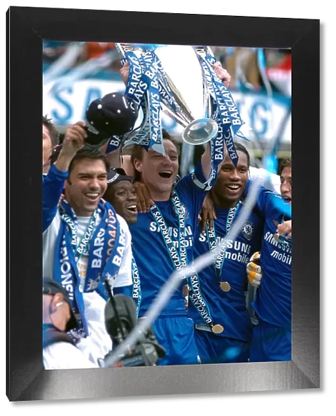 Chelsea's Glory: John Terry Celebrates Premier League Victory with the Trophy (2005-2006)