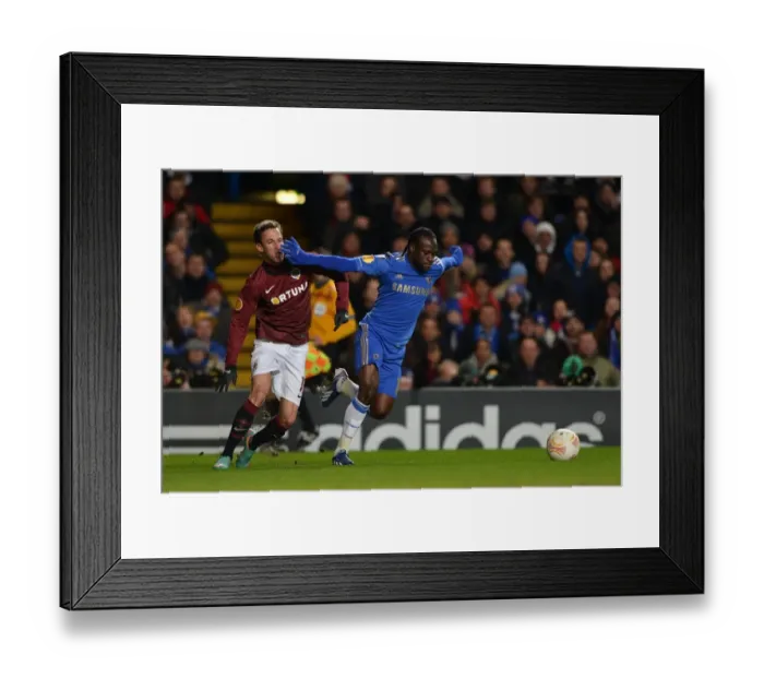 Framed Print : Clash of Titans: Victor Moses vs. Matej Hybš in the UEFA Europa League Round of 16 Showdown at Stamford Bridge (February 2013) Framed Print : Clash of Titans: Victor Moses vs. Matej Hybš in the UEFA Europa League Round of 16 Showdown at Stamford Bridge (February 2013)
