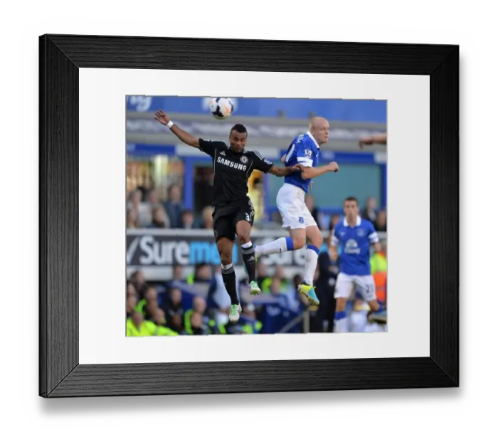 Framed Print : Battle for the Ball: Ashley Cole vs. Steven Naismith - Everton vs. Chelsea, Premier League Showdown (September 14, 2013)