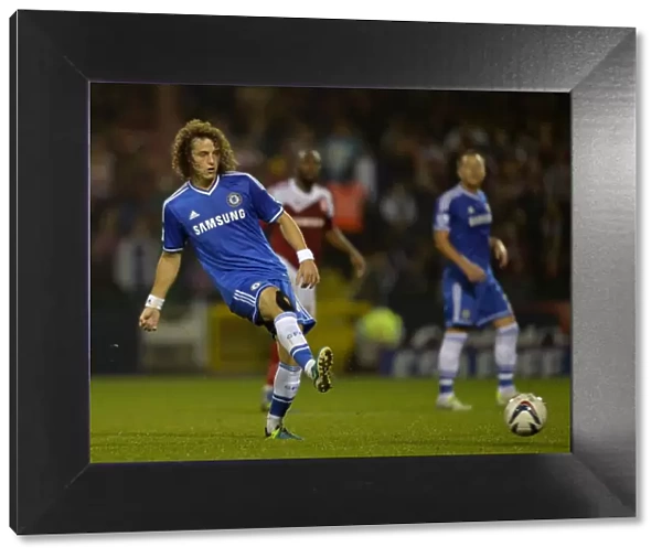 David Luiz in Action: Chelsea's Thrilling Pass at Swindon Town's County Ground during Capital One Cup Third Round (September 24, 2013)