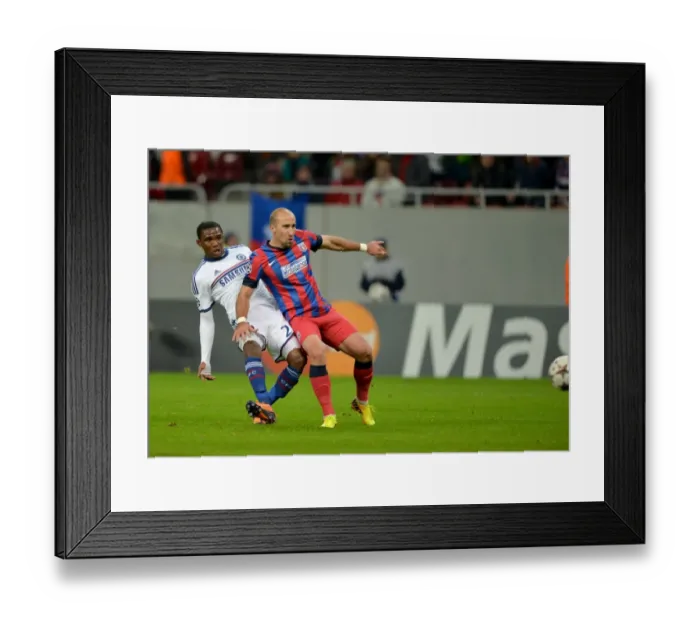 Framed Print : Samuel Eto'o's Unfortunate Own-Goal vs. Steaua Bucuresti: A Bittersweet Double for Chelsea in Champions League (1st October 2013)