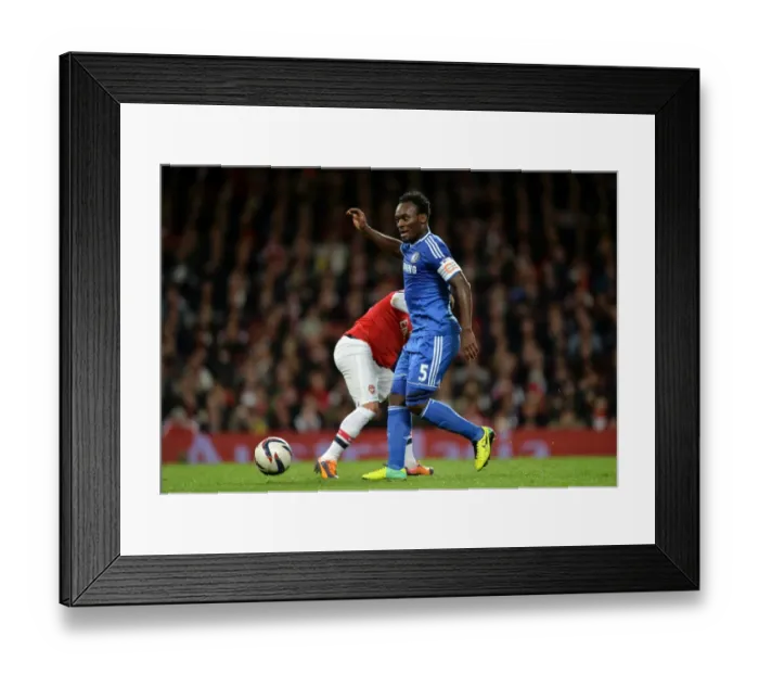 Framed Print : Michael Essien's Midfield Masterclass: Chelsea Shines at Emirates Against Arsenal (Capital One Cup, 29th October 2013)