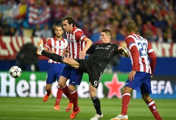 Battle for the Ball: Diego Godin vs. Fernando Torres in the Intense UEFA Champions League Semi-Final Clash at Vincente Calderon Stadium (April 22, 2014)