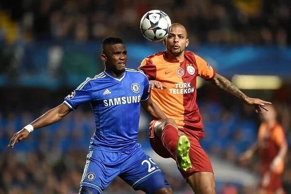 A Battle for the Ball: Eto'o vs. Melo in the UEFA Champions League Round of 16 Showdown at Stamford Bridge, March 18, 2014