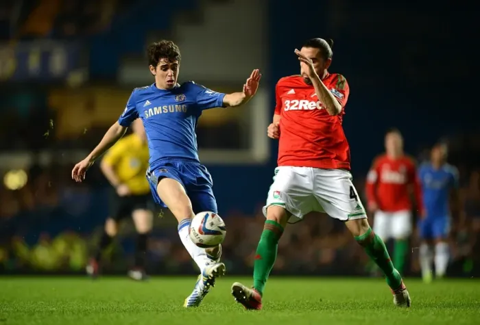 Framed Print : A Battle for the Ball: Oscar vs Chico - Chelsea vs Swansea City, Capital One Cup Semi-Final, Stamford Bridge (9th January 2013)