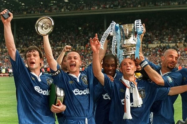 Chelsea with cup 2. Some of the Chelsea team celebrate after claiming the